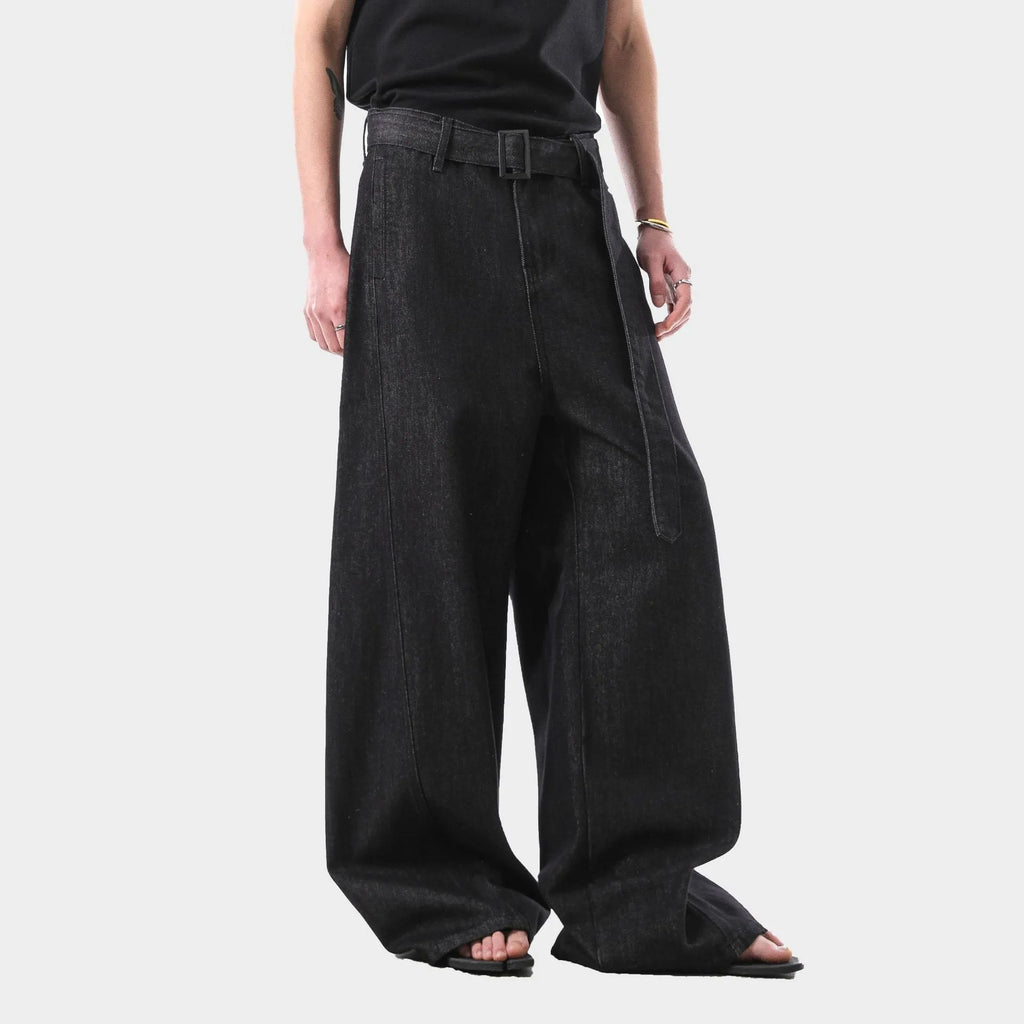 Black women's high waist straight leg jeans with gold detailing on a mannequin, showing the zip fly and classic denim cut.
