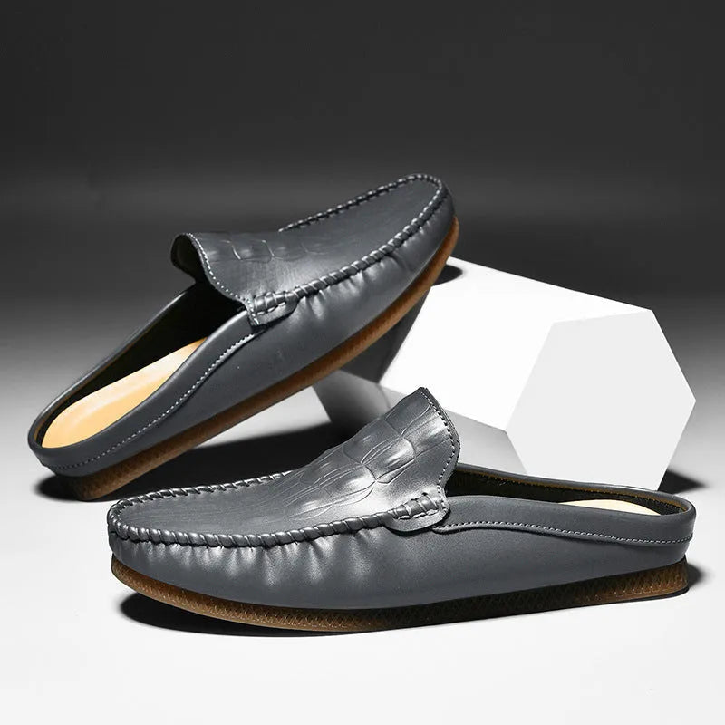Men's black breathable Gommino semi-slippers with a rubber sole on a plain background