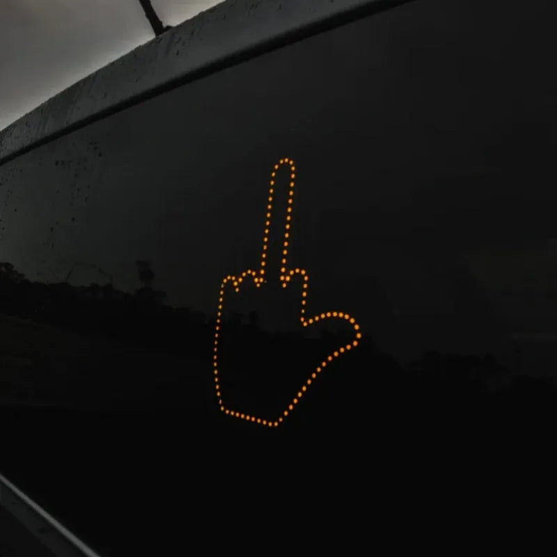 Black plastic LED car gesture light showing middle finger gesture with remote control