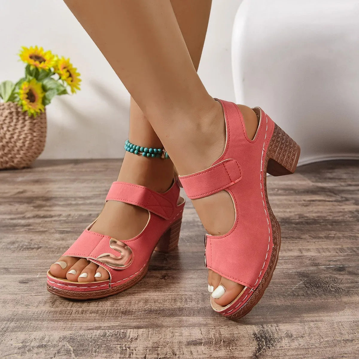 Light brown Velcro Roman sandals with adjustable straps on a rubber sole.