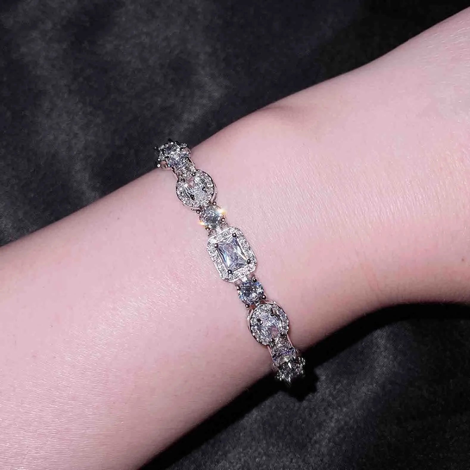 Women's geometric S925 silver-plated bracelet with inlaid zircon stones, shown in two size options.