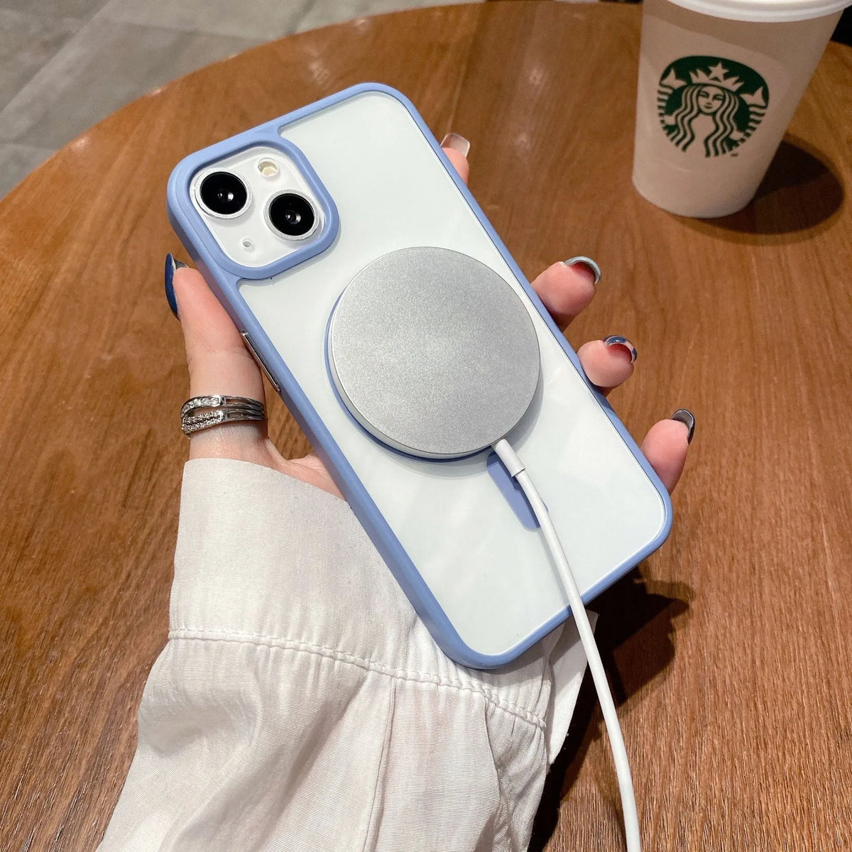Transparent acrylic MagSafe phone case showing magnetic ring, compatible with iPhone 12 and 13 models