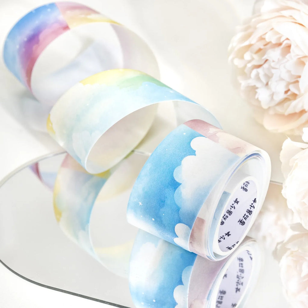 Roll of Japanese paper washi tape with colourful sky cloud patterns, showing 30mm width