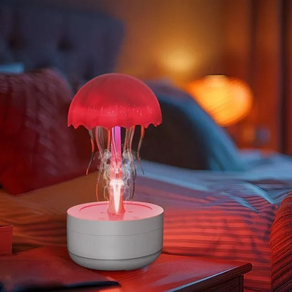 White jellyfish-shaped humidifier diffuser with colourful LED lights and visible mist output