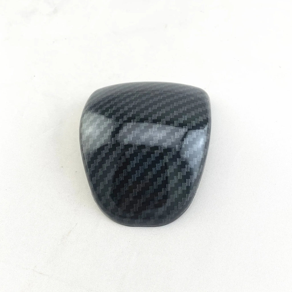 Car gear shift cover with carbon fibre pattern finish