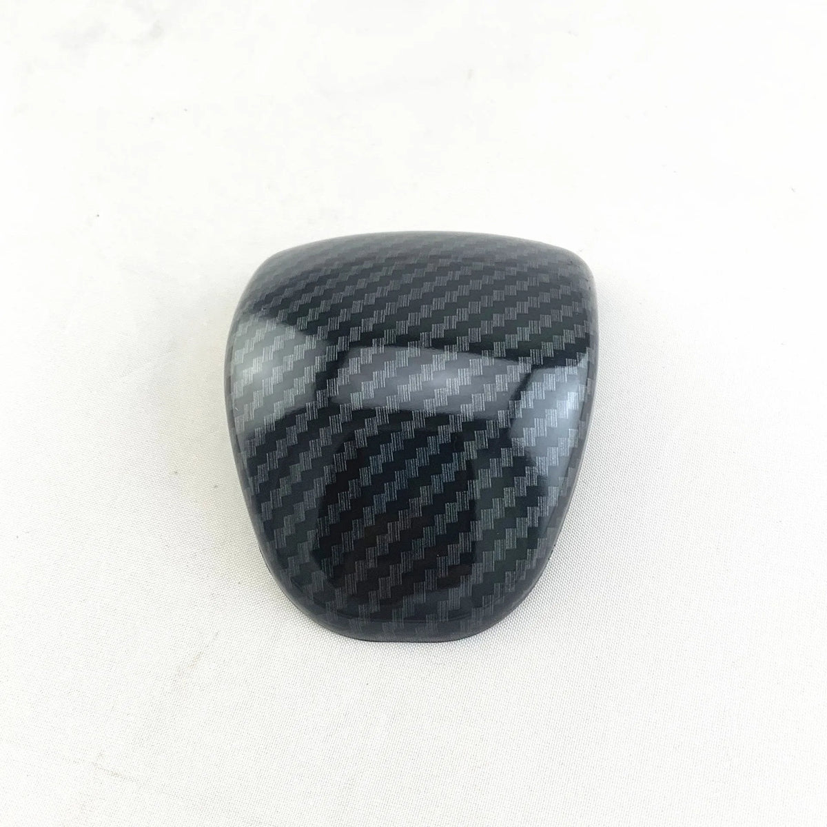 Car gear shift cover with carbon fibre pattern finish