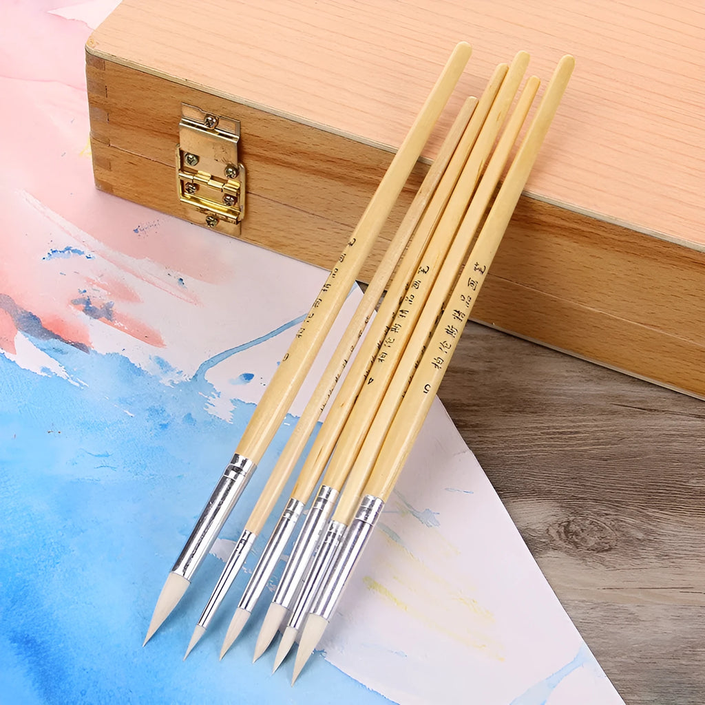 Set of six wooden hook line pen brushes for yarn craft on a table.