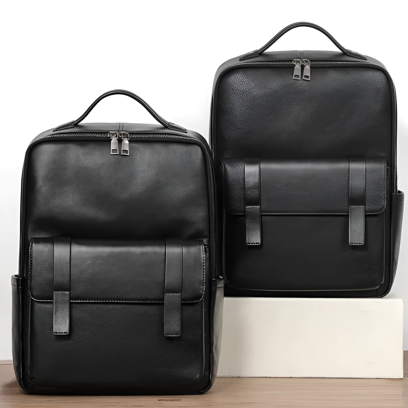 Men's black genuine leather large capacity laptop backpack with weave details.