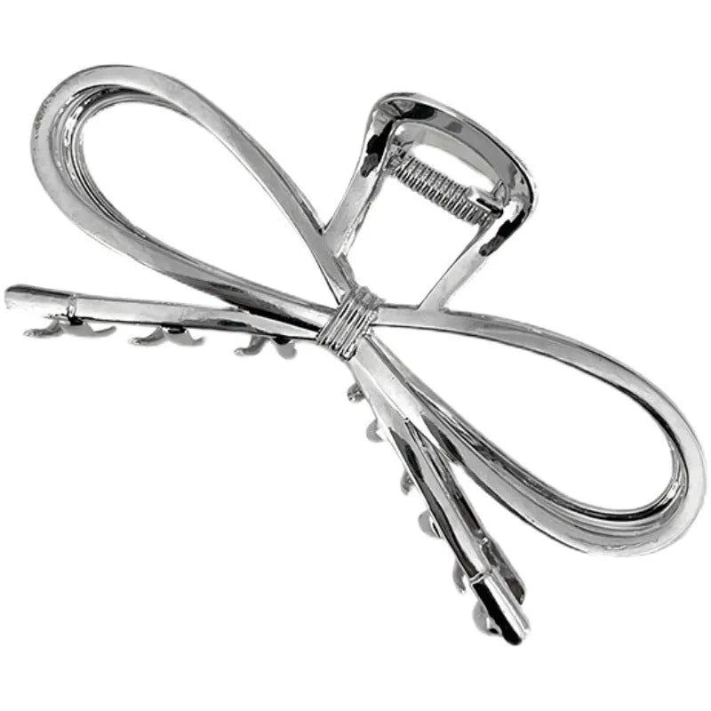 Women's Korean style bow hair barrette with alloy construction in silver or gold colour option
