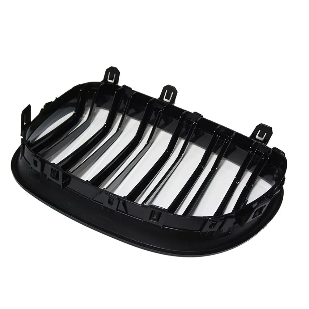 Pair of ABS carbon fibre pattern grilles for a BMW 5-Series front bumper.