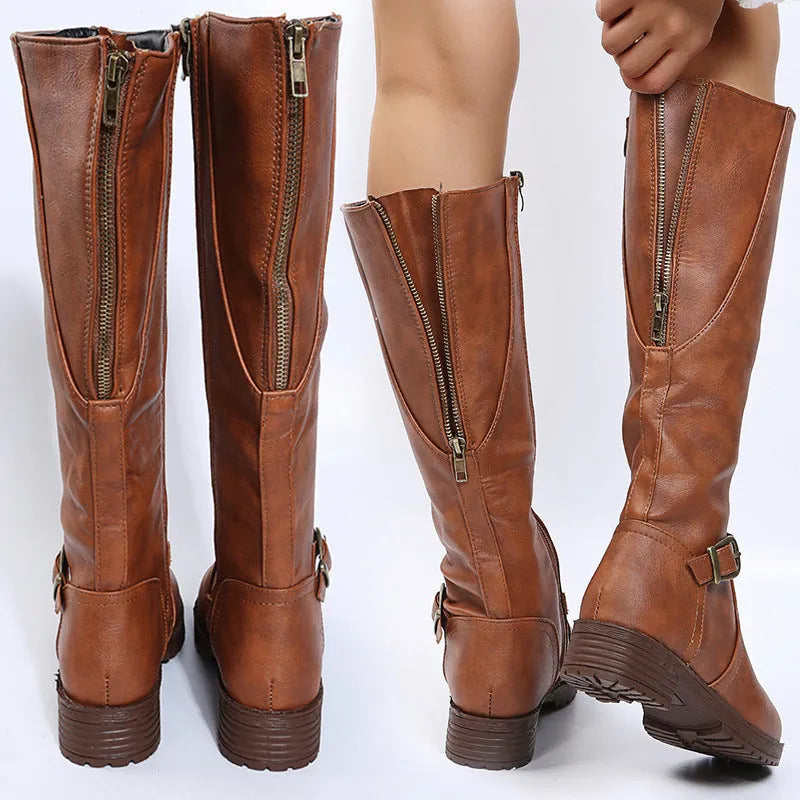 Yellow women's knight boots with a square heel, round toe, and buckle detail on a high calf shaft.