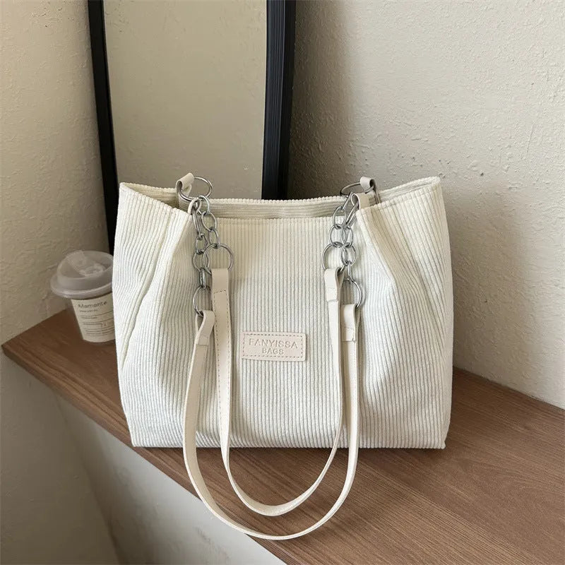 Corduroy one-shoulder tote bag in horizontal square shape with three-dimensional pocket