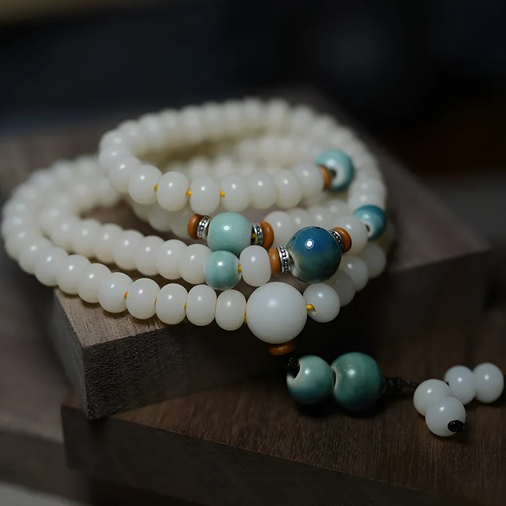 White jade bodhi seed bracelet with 108 flat round beads in 7x9mm and 8x10mm sizes