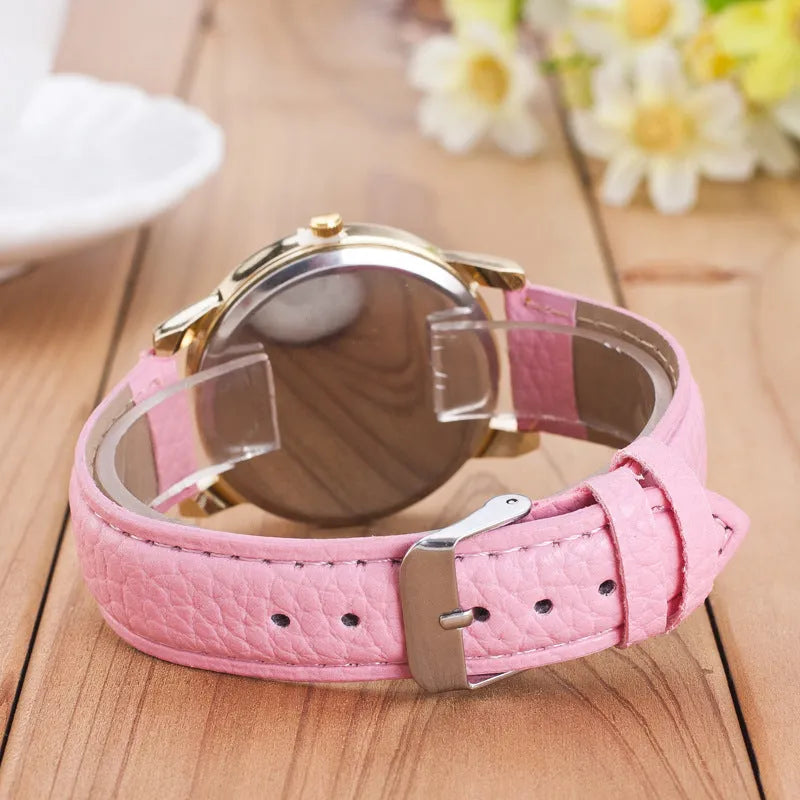 Geneva women's quartz watch with blue dial, round alloy case, and imitation leather strap on display