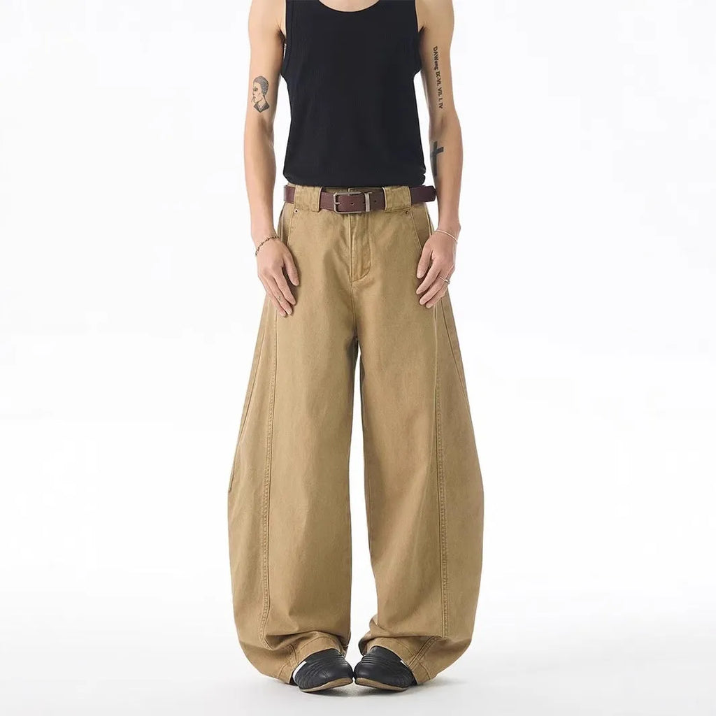 Brown men's loose-fit straight-leg jeans with a button fly and mid-rise waist.