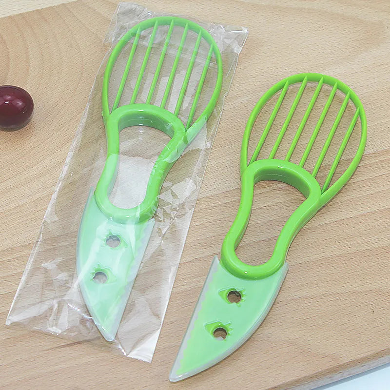 Multifunctional avocado knife in green and orange polypropylene for slicing and peeling fruit