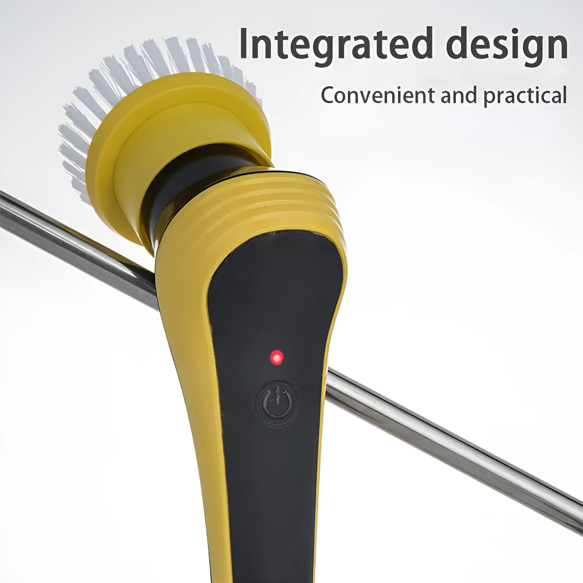 Yellow electric cleaning brush with adjustable handle and USB charging cable on bathroom floor