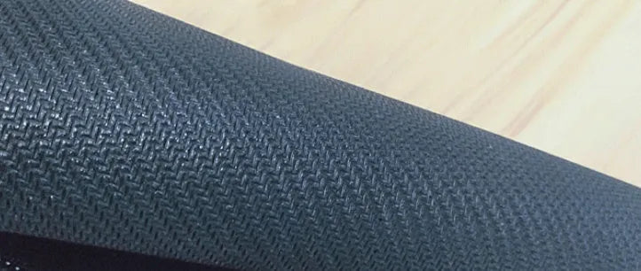 Large rectangular desk pad with printed pattern and natural rubber non-slip base for office or gaming desks.