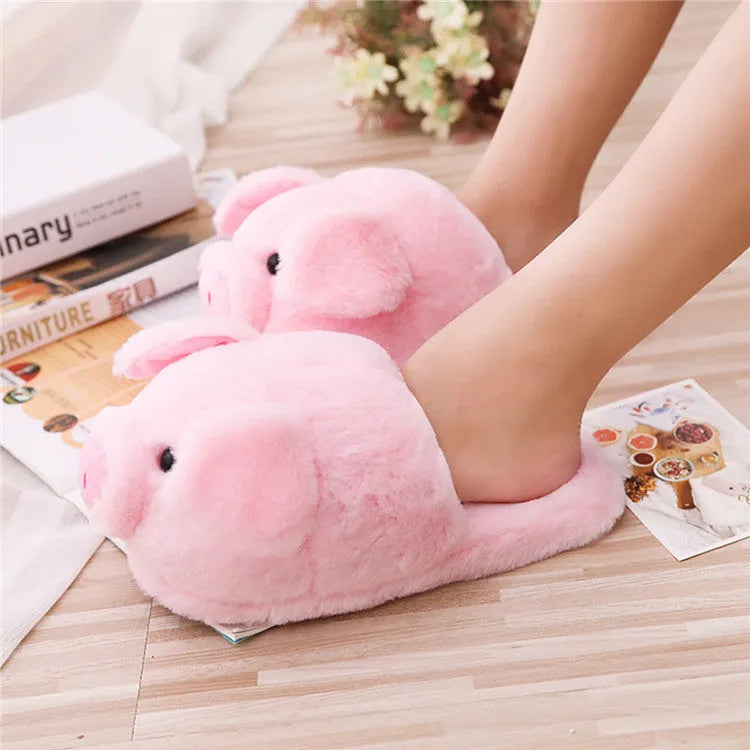 Pink pig-shaped floor slippers made from short plush fabric.