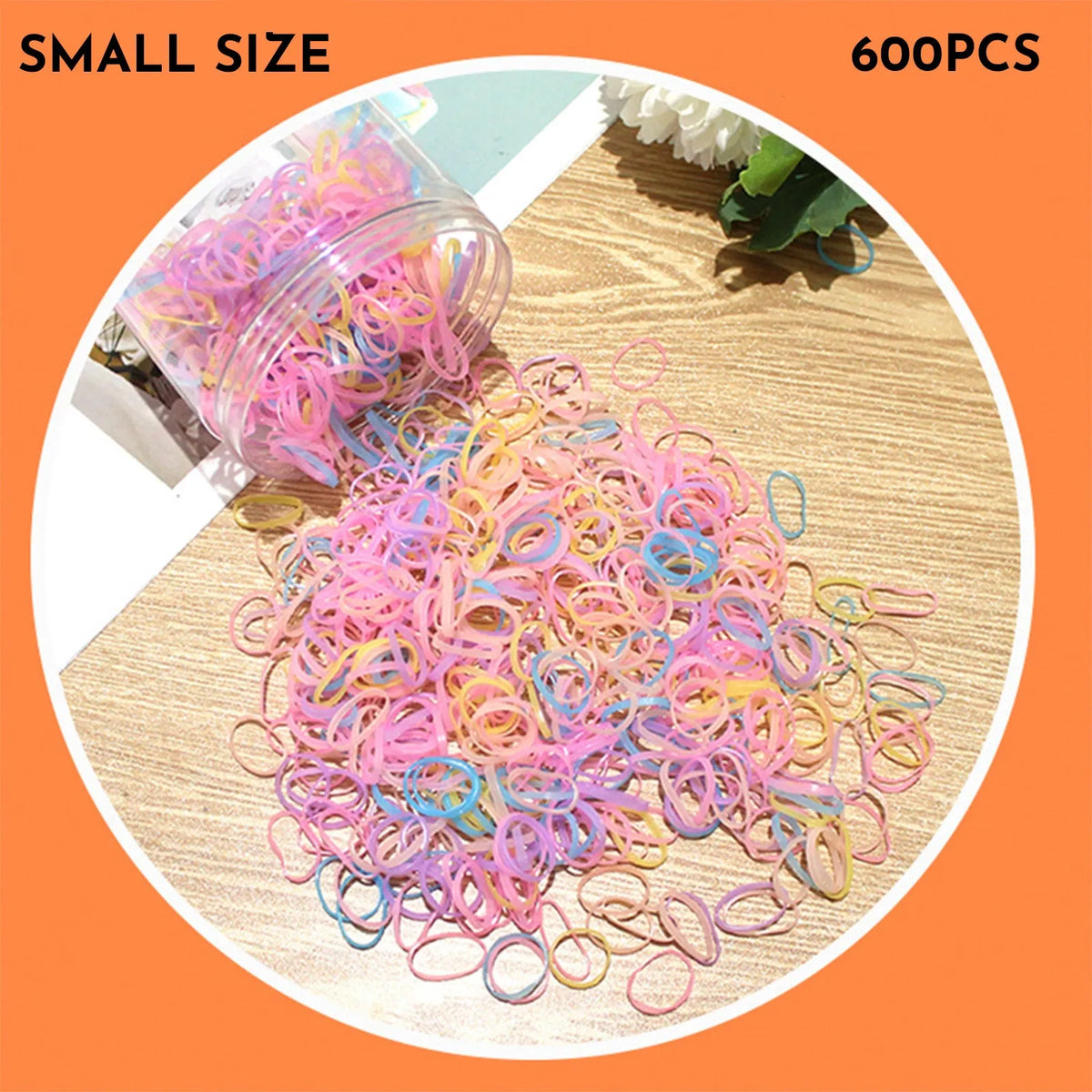 Multi-colour TPU baby hair elastic bands spilling from a reusable container.