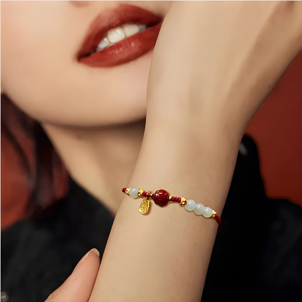 Adjustable women's bracelet with Hetian jade, cinnabar red rope, and 925 silver components