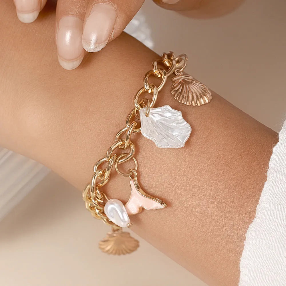 Women's shell pearl mermaid tail bracelet in white pearl alloy finish