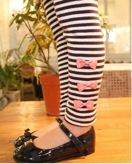 Girls pink cotton clothing set showing coordinated pieces available in four size options