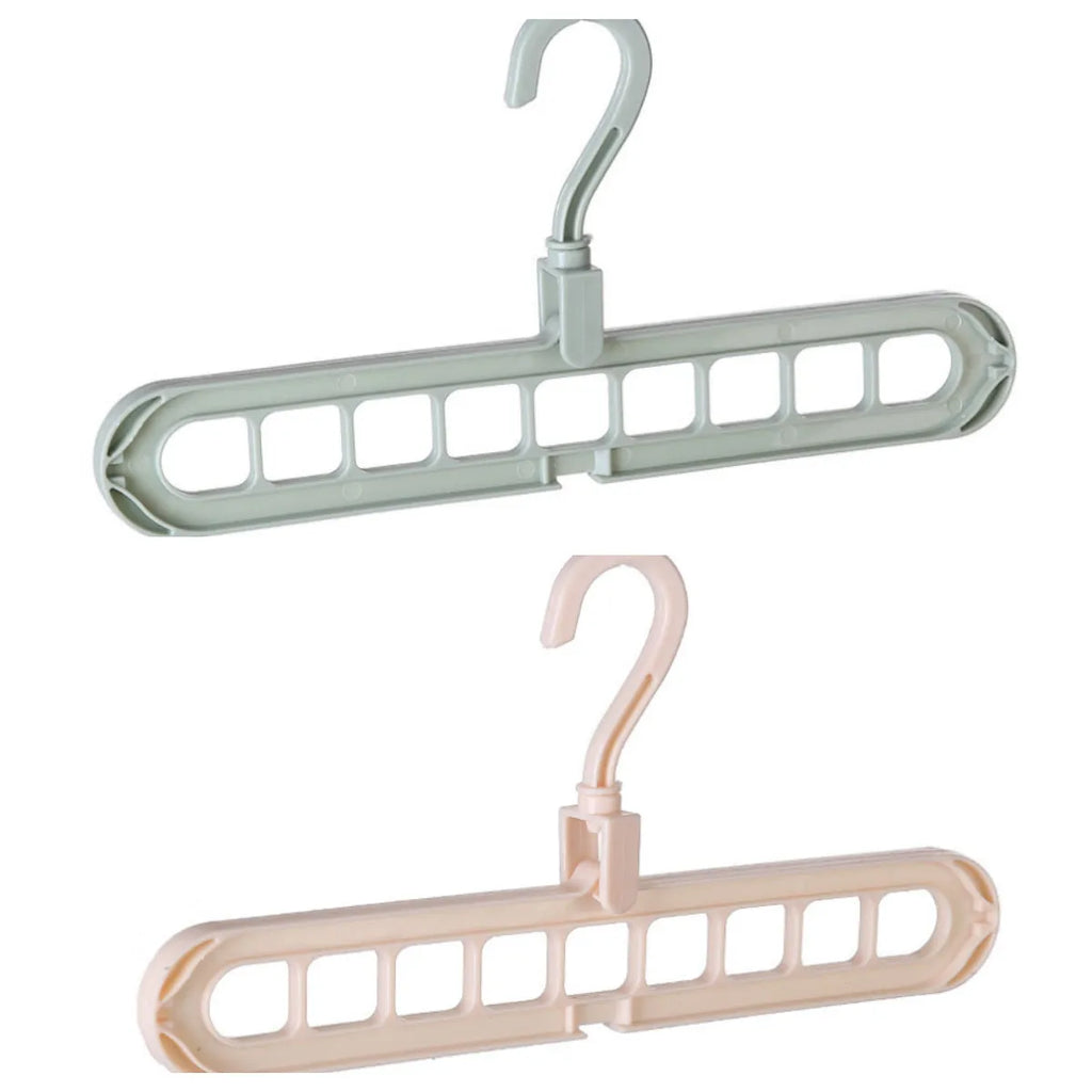 Pink plastic clothes hanger with a 360-degree rotating hook on a white background.