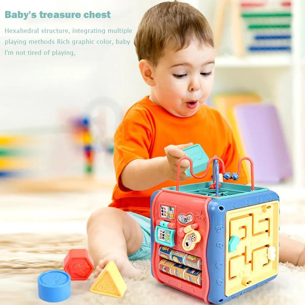 Baby hexahedron educational cube showing six sides with bead maze, clock, number tray, gears, car track, and butterfly activities
