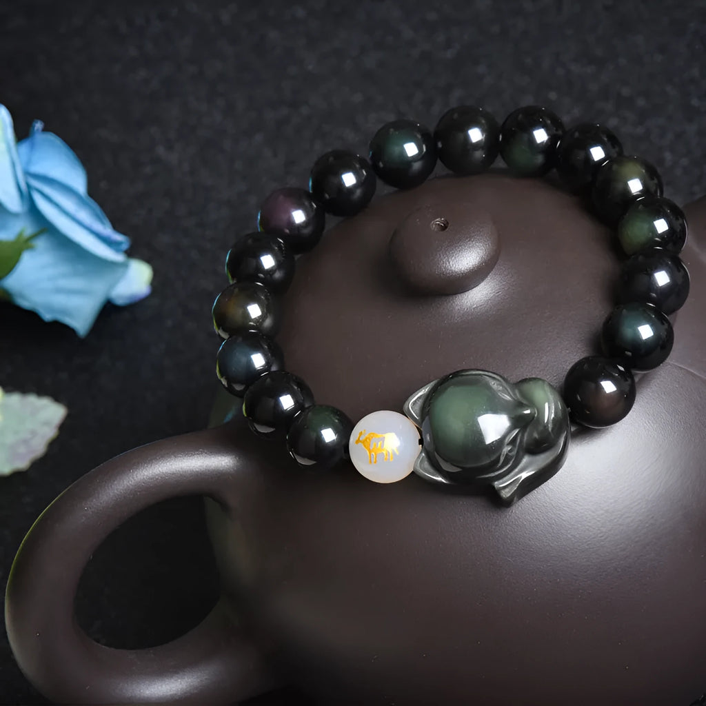 Natural black obsidian bracelet with 10mm beads and zodiac design in gold, silver, or pure stone variations