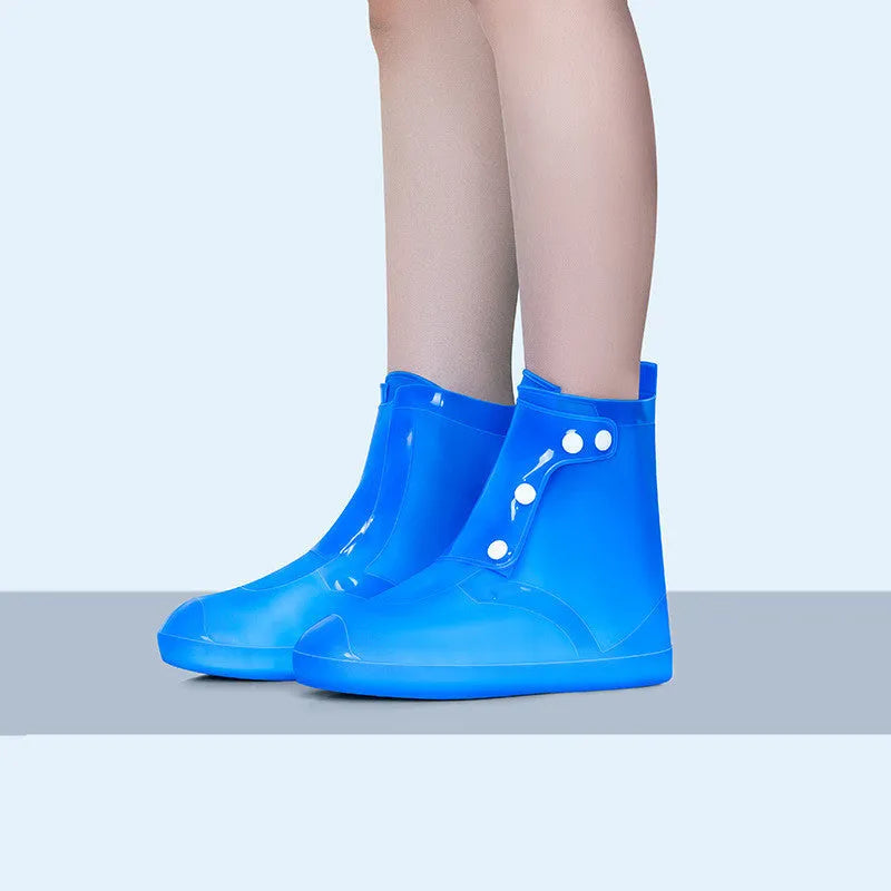 White high-top PVC reusable shoe covers for women with anti-skid sole.