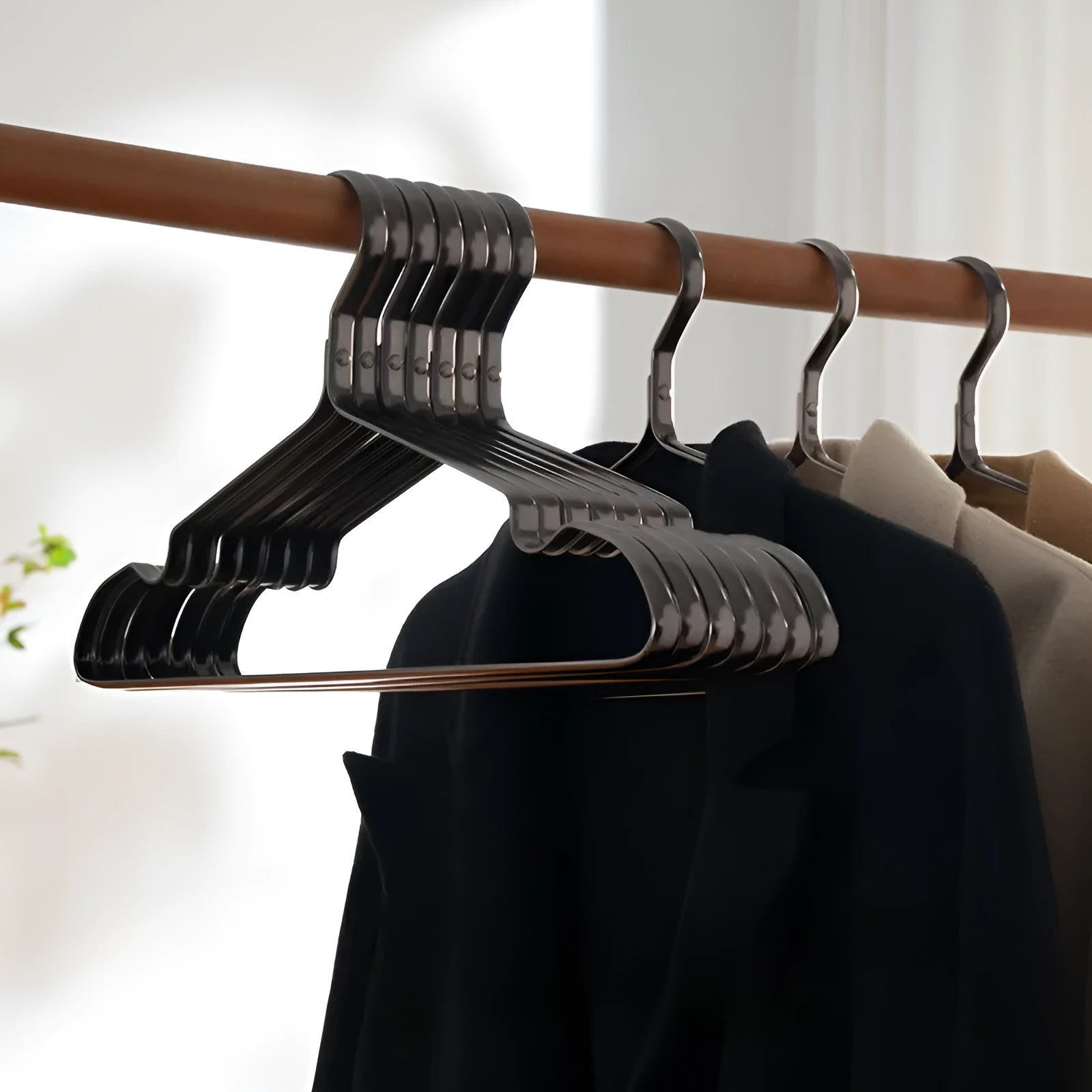 Elegant black modern clothes hanger with anti-slip, anti-rust, and anti-fade features.
