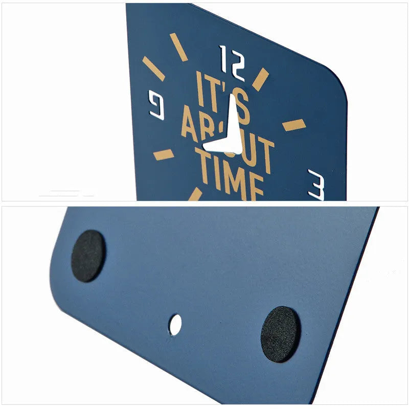 Set of two iron hollow L-shaped bookends in Clock Blue colour on a desk holding books upright