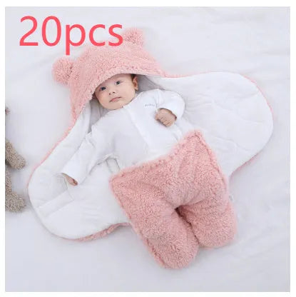 A baby quilted sleeping bag wrapper in a cotton blend fabric, shown in a light blue colour, laid flat.