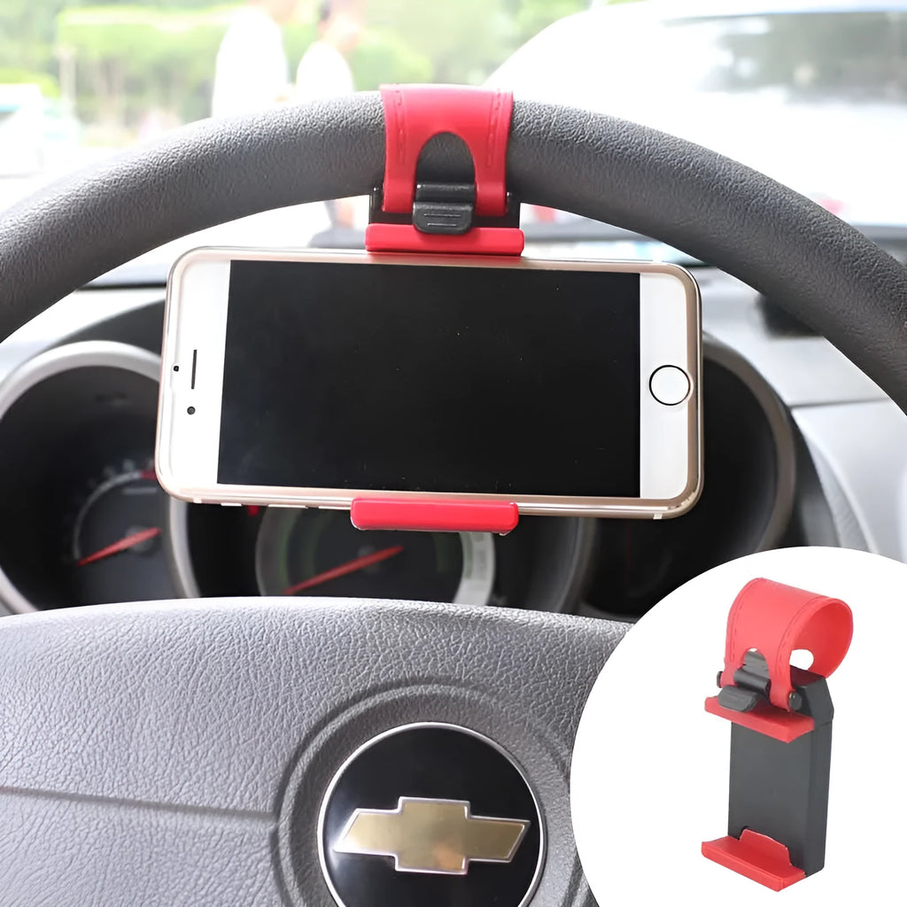 Black steering wheel phone clip mount holding smartphone with soft silicone padding visible