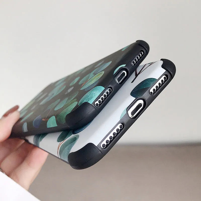 Black silicone iPhone case with raised leaf pattern texture on back