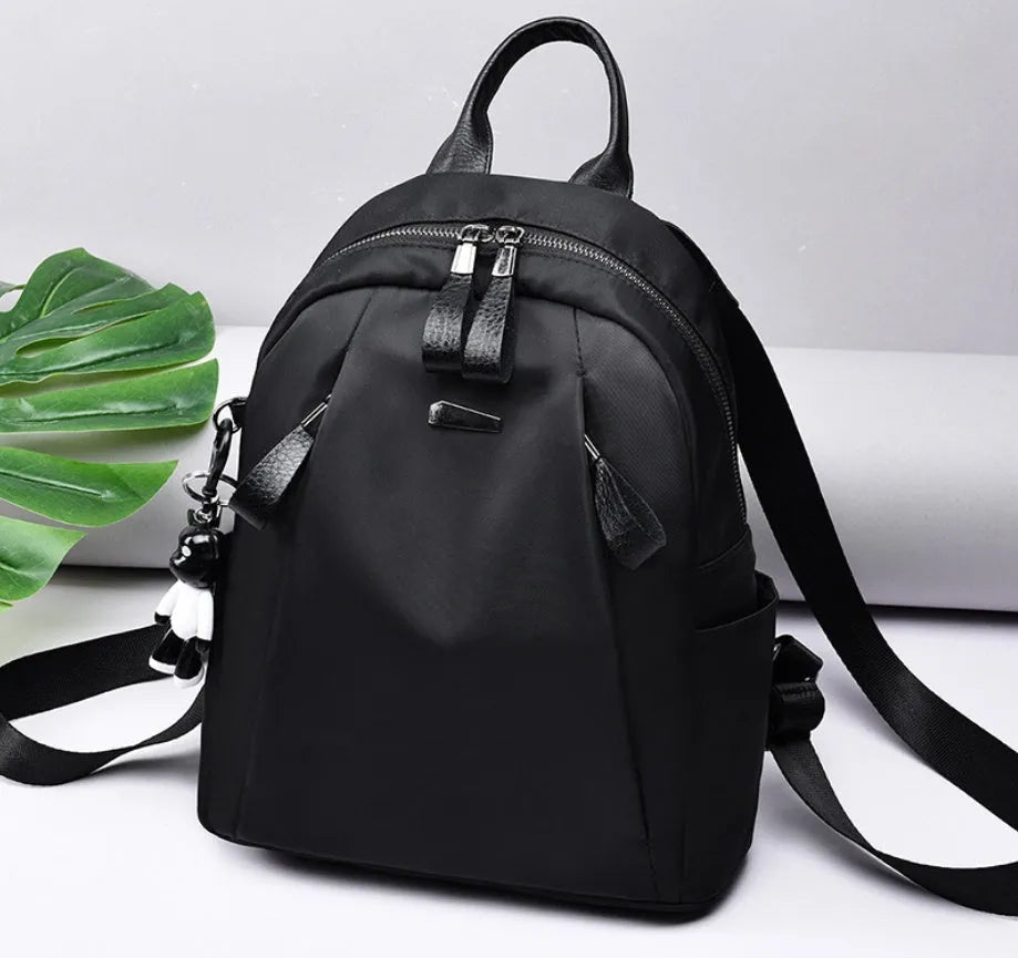 Medium square rucksack in Oxford cloth with double straps and internal organisation pockets