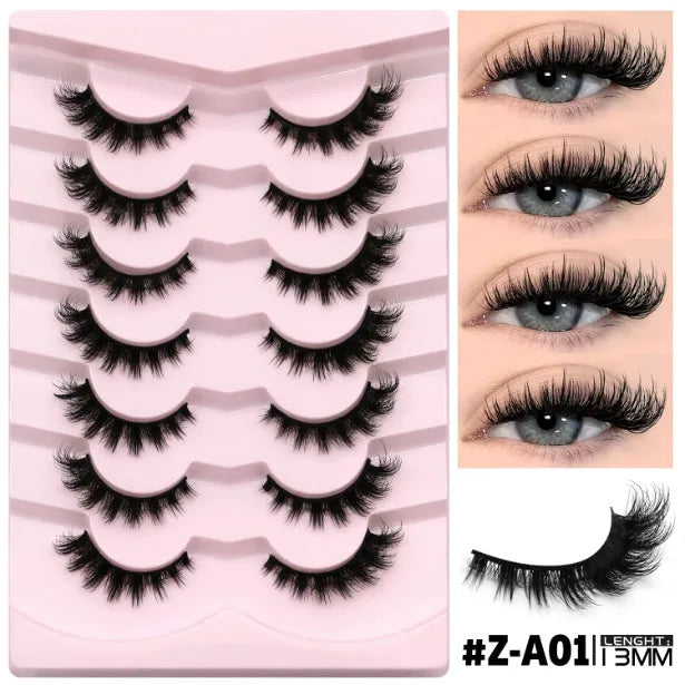 Box of artificial fibre false eyelashes in a natural long thick style with a tube of adhesive glue