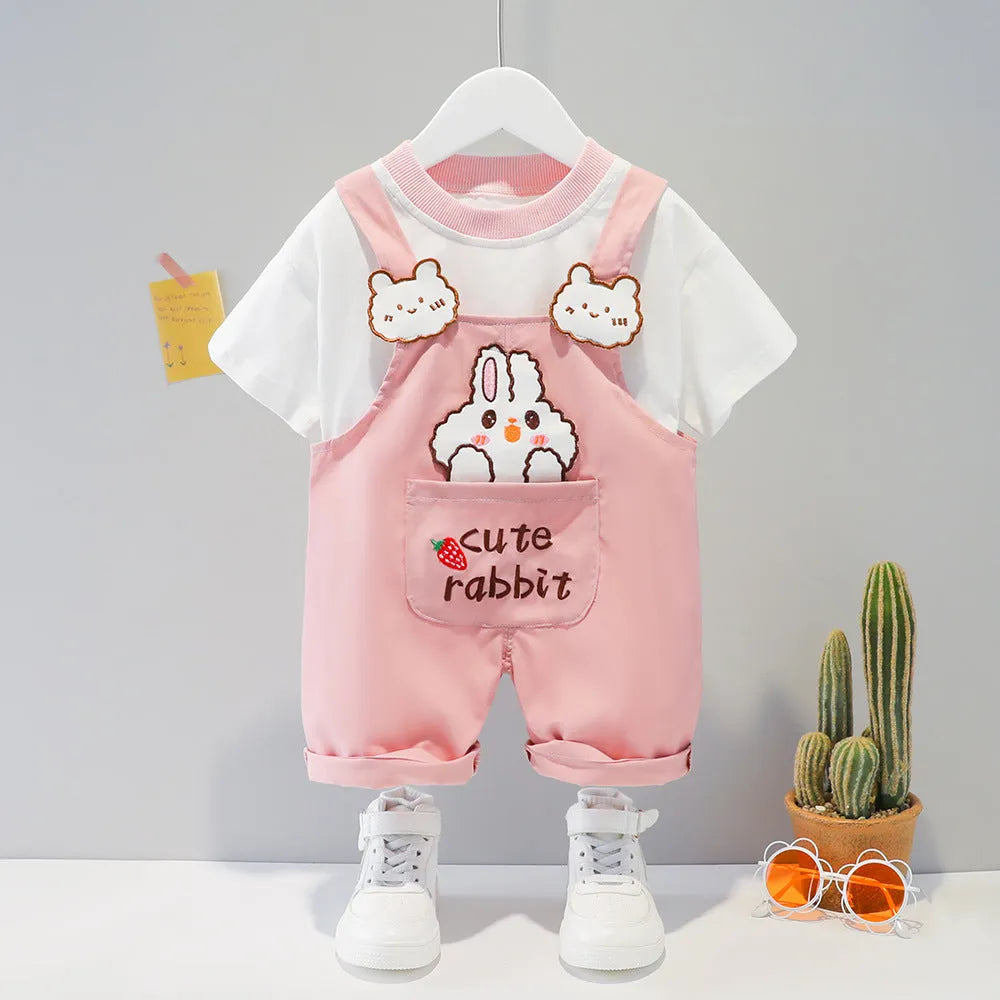 Yellow cotton baby overalls with cartoon print, short sleeves, and adjustable straps on a hanger.