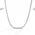 Women's sterling silver necklace with diamond-cut round pendant