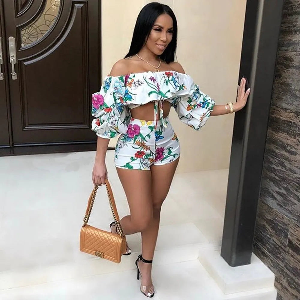 Women's two-piece set with multicolour digital print, pile sleeves on crop top, and matching shorts.