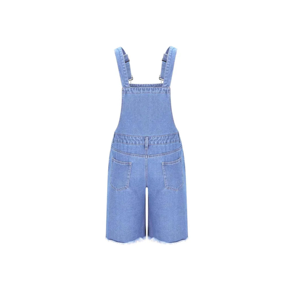 Man wearing dark blue ripped denim shorts with black suspenders, casual leisure style