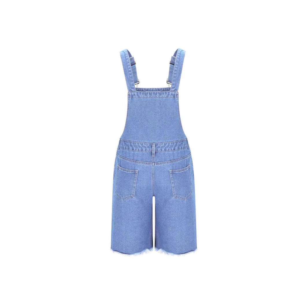Man wearing dark blue ripped denim shorts with black suspenders, casual leisure style