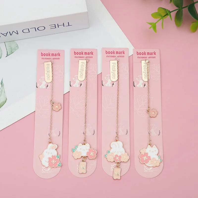 Metal book holder with pendant featuring cute cartoon cherry cat or rabbit sakura design