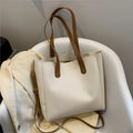 Single shoulder crossbody bag in PU with horizontal square shape, available in white, yellow, black or brown.