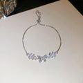 Copper flower butterfly pendant bracelet with inlaid zircon stones gold colour on white background