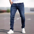 Dark blue men's slim fit skinny jeans with zipper fly on mid waist