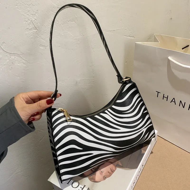 Small square women's underarm bag in PU material with multiple colour pattern options