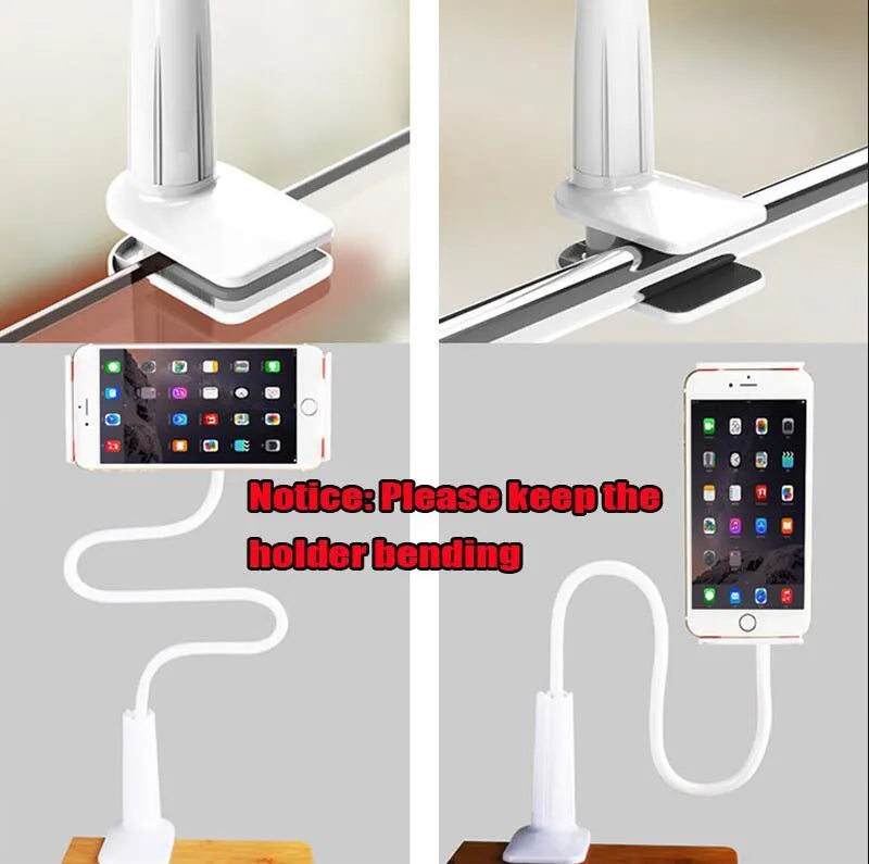 Black aluminium alloy and plastic bedside phone handset with long arm extended on a wooden table.