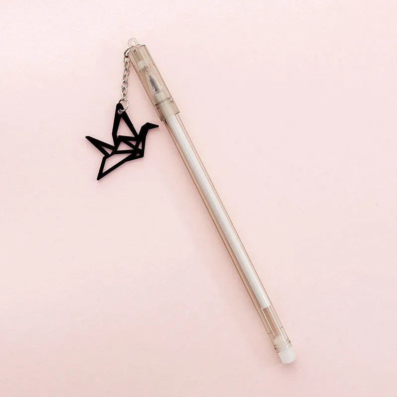 Plastic gel pen with decorative paper crane pendant and 0.38mm fine tip, shown at 17cm length.